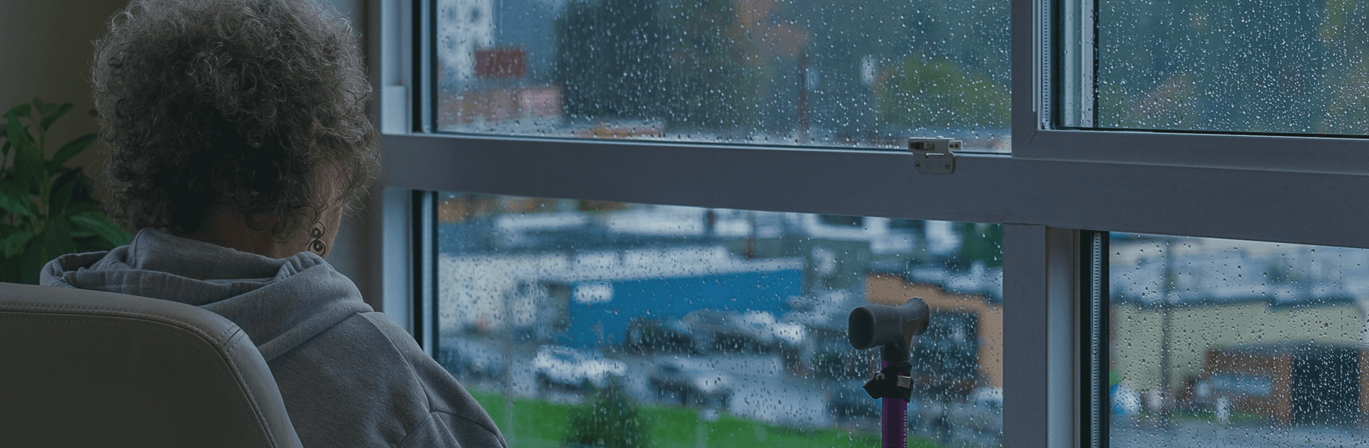 Senior looking out window